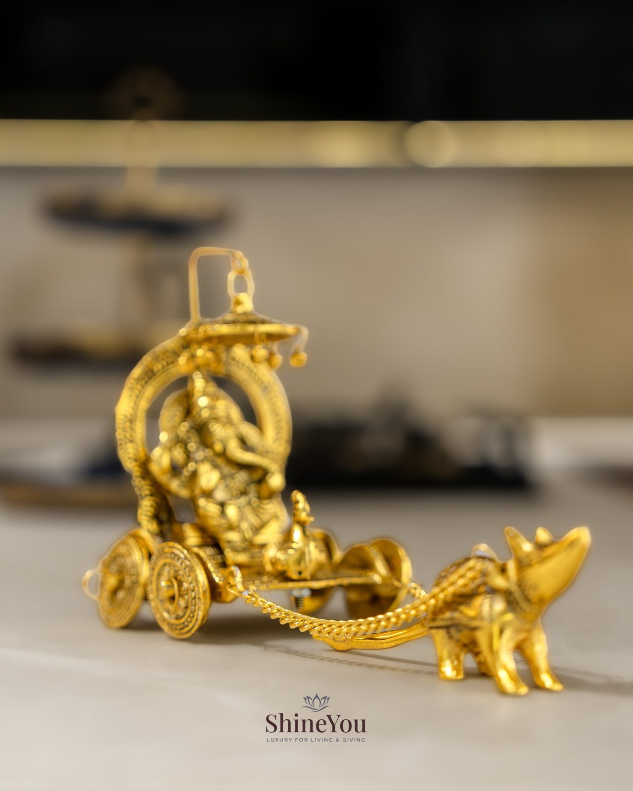 Gold-finish Ganesha on a chariot